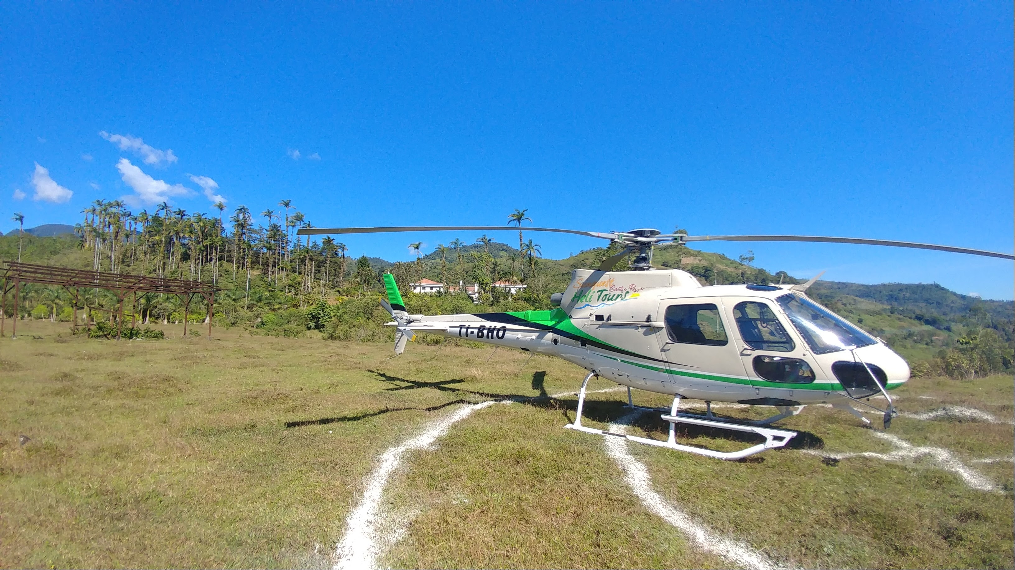 Wide view of the estate helipad landing pad surrounded by tropical landscape
